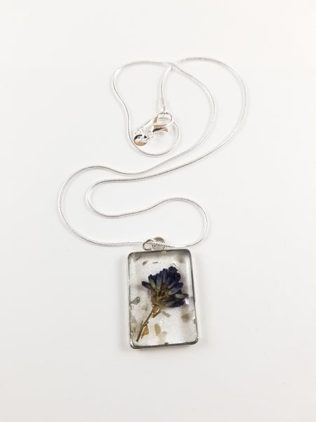 Silver square pendant with purple flower