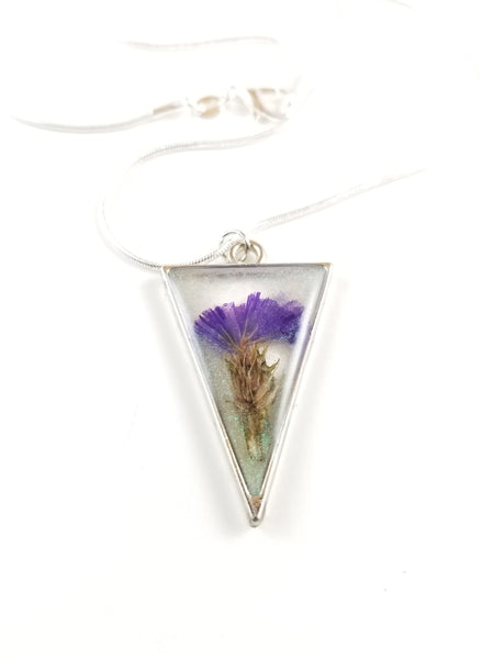 Silver triangle with purple flower