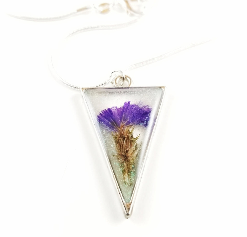 Silver triangle with purple flower