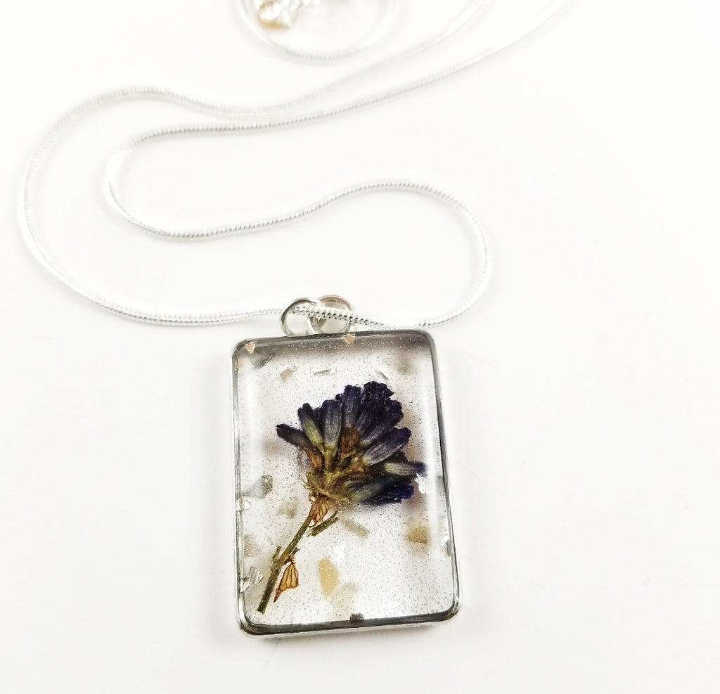 Silver square pendant with purple flower